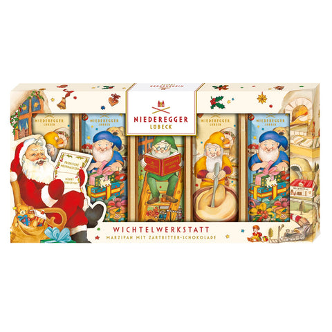 Chocolate-covered marzipan bars from Elves' Workshop by Jag Couture London New York, displayed on a festive plate.