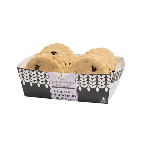 Farmhouse currant Shrewsbury biscuits in a tray by Jag Couture London New York, showcasing golden-brown biscuits with currants.