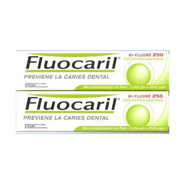 Fluocaril mint flavored toothpaste for cavity prevention in 2x125ml tubes, displayed with a tube of toothpaste and mint leaves.
