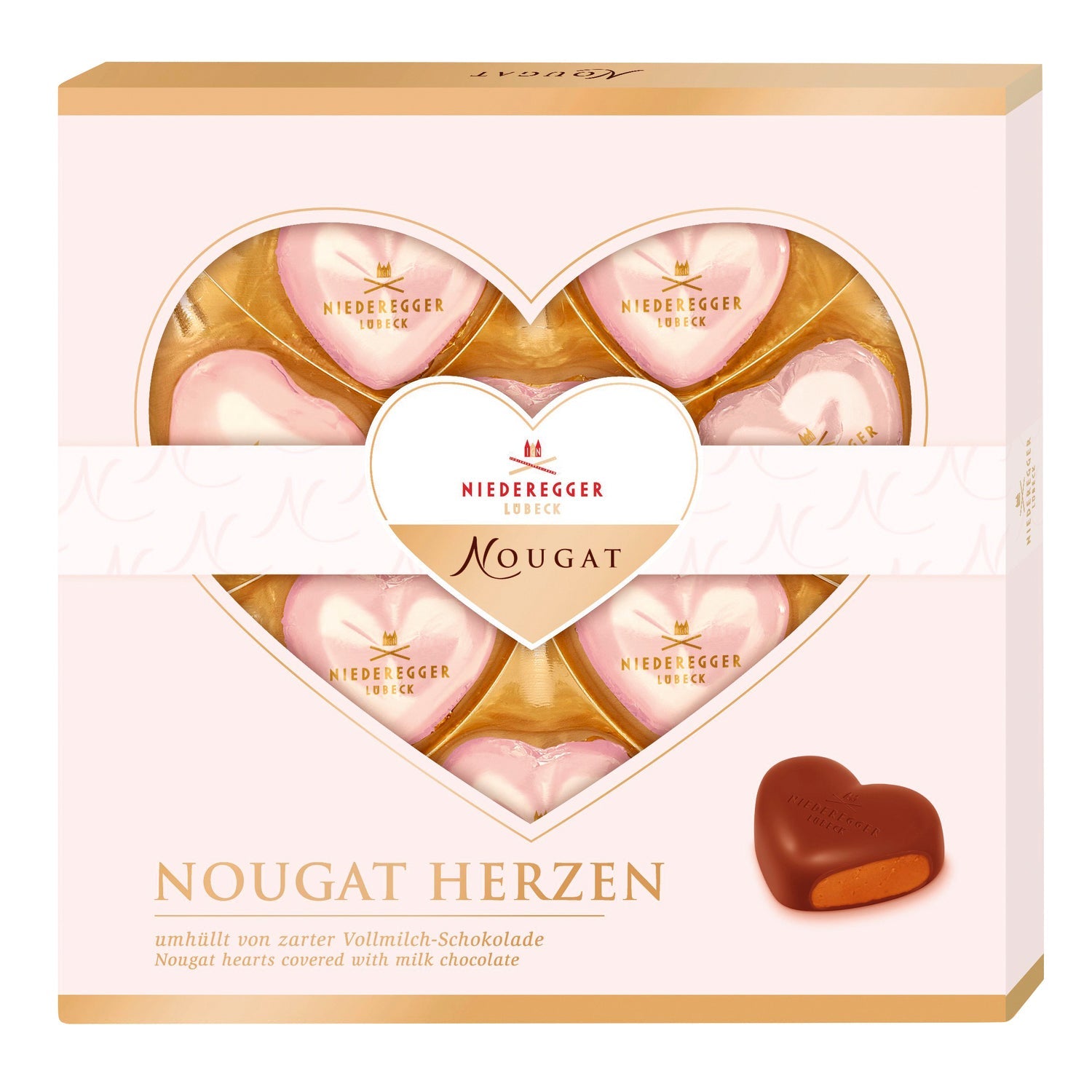 Assorted foiled milk chocolate praline hearts in a gift box by Jag Couture London - New York, arranged beautifully.