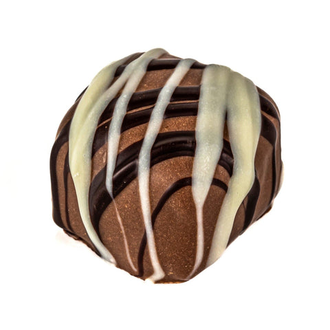Jag Couture London hazelnut praline in milk chocolate with stripes, 16g, showcasing a smooth, striped hazelnut chocolate treat.