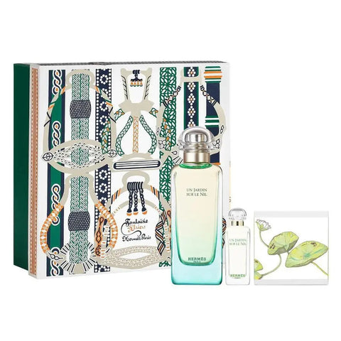 Hermès Un Jardin Sur Le Nil fragrance set with bottles and packaging, displayed on a neutral background.