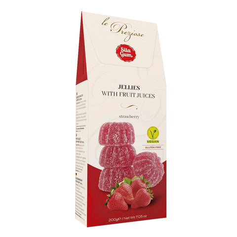 Italian strawberry jellies by Jag Couture London New York displayed in a clear glass jar with vibrant red jellies inside.