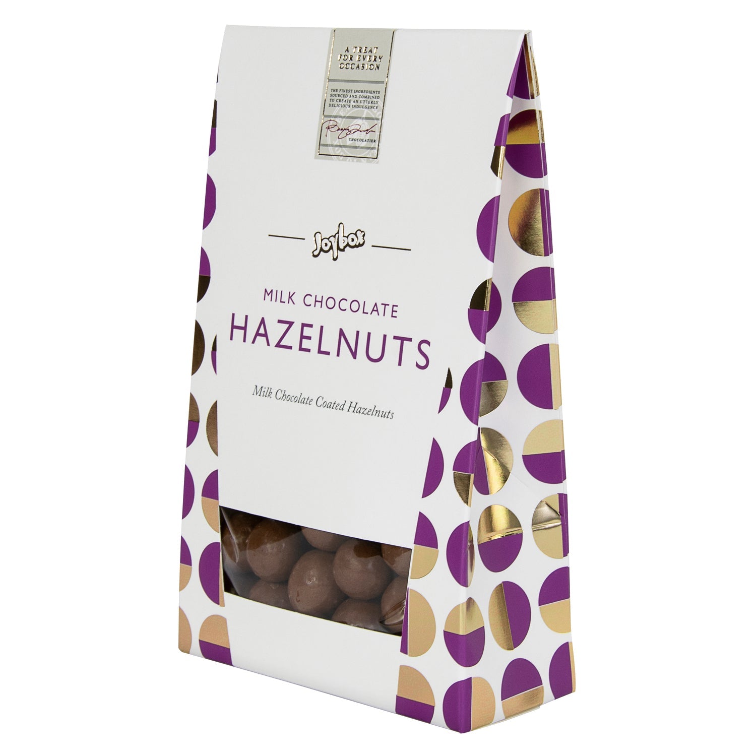 Joybox hazelnuts coated in milk chocolate from Jag Couture London in a carton, displayed in a natural, close-up shot.