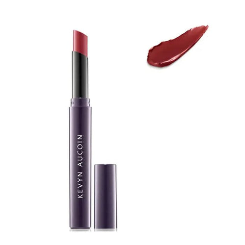 Kevyn Aucoin Unforgettable Lipstick Cream in Bloodroses, showcasing a rich, deep red lipstick in sleek packaging.