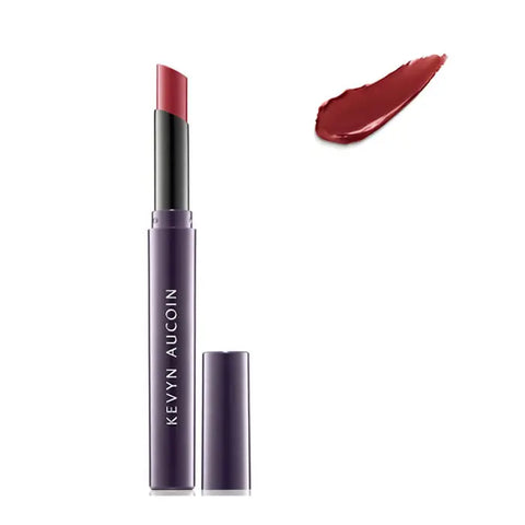 Kevyn Aucoin Unforgettable Lipstick Cream in Bloodroses, showcasing the rich red lipstick in a sleek tube by Jag Couture London - New York.