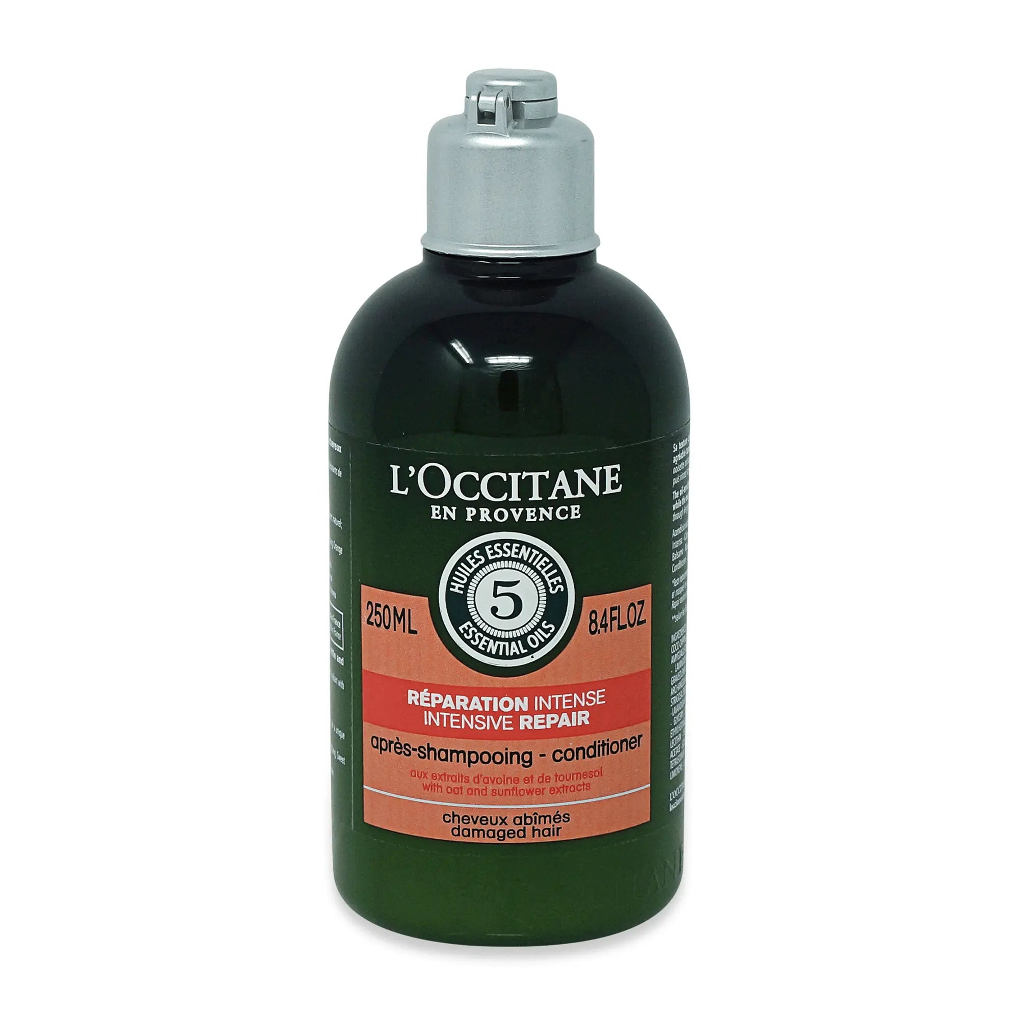 L'Occitane Aro Reparateur after-shampoo bottle from Jag Couture London New York, 250ml, with a white and purple label and cap