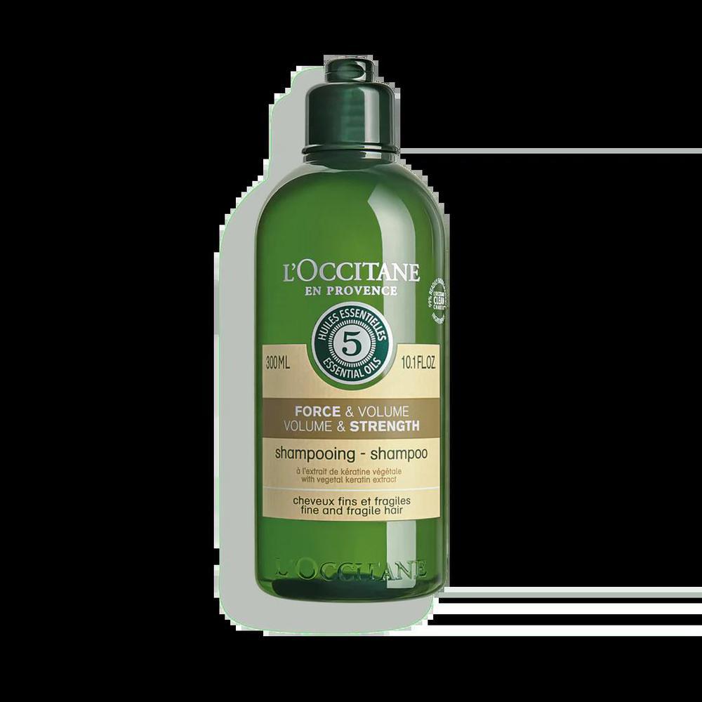 L'Occitane Strength and Volume Shampoo 300ml in a clear bottle with a white and gold label, suitable for hair care.