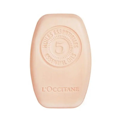 L'Occitane Intensive Repair Solid Shampoo 60g by Jag Couture London - New York, showing the solid shampoo bar in a natural setting.