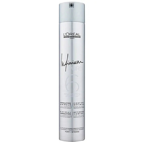 L’Oréal Professionnel Infinium Strong Hairspray in 500ml spray bottle on a salon table with hair styling tools.