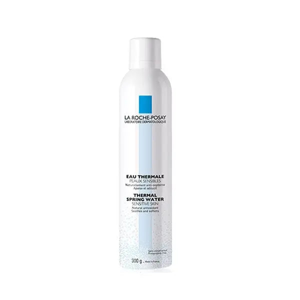 La Roche Posay Thermal Water 300ml spray bottle with blue cap, from Jag Couture London New York, on a white background.