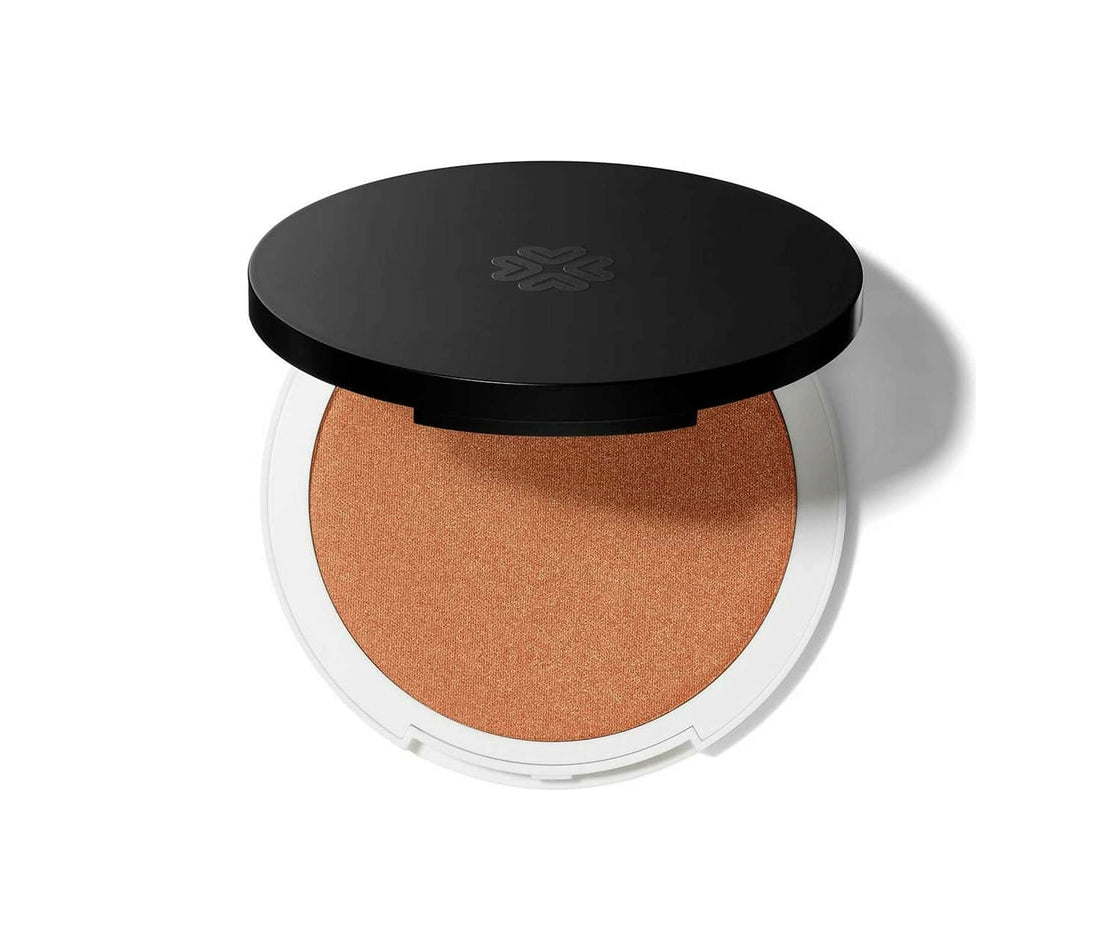 Lily Lolo mineral illuminator and bronzer compact by Jag Couture London, featuring a shimmery highlighter and bronzer in a sleek case.