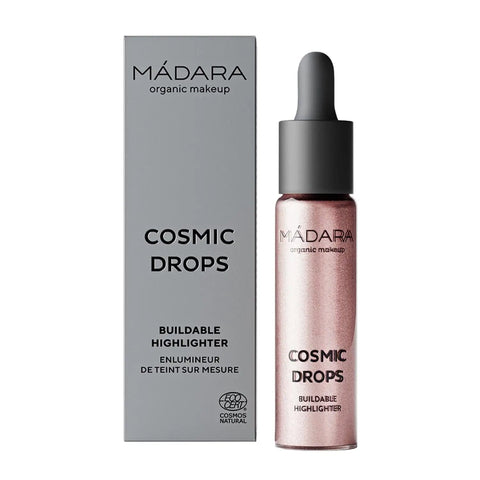 Mádara Cosmic Drops Iluminador 02 Cosmic Rose in 13.5ml bottle, showcasing the luminous glow and rose-colored liquid.