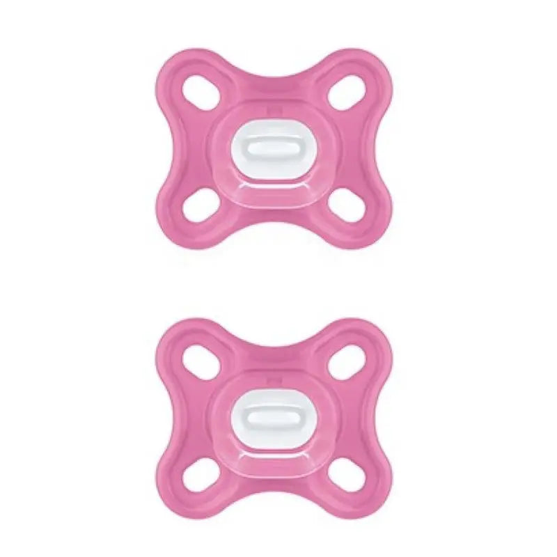 Two pink Mam Comfort pacifiers made of 100% silicone with sterilizing box, for infant soothing and comfort.