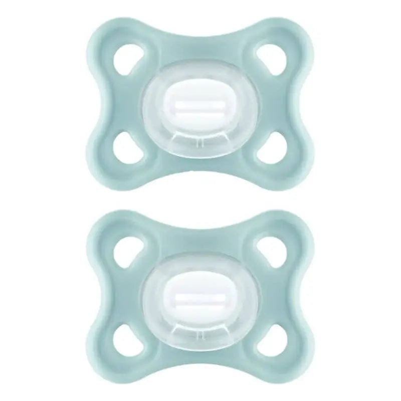 Two neutral Mam Comfort pacifiers for 3-12 months, designed for babies, by Jag Couture London New York.