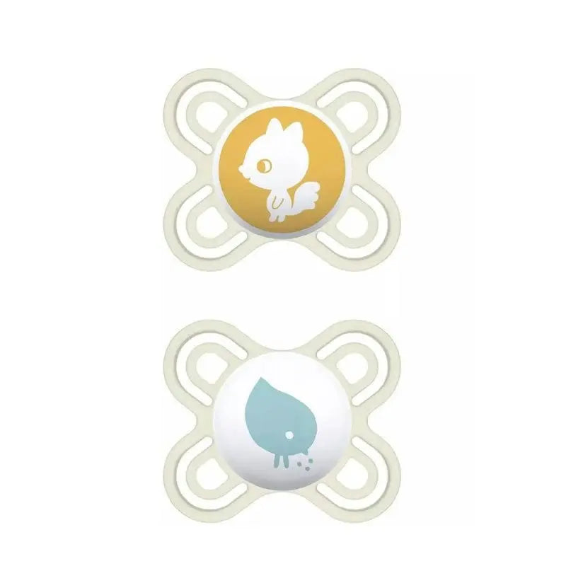 Two Mam Perfect Pacifiers for 2-6 months, unisex, from Jag Couture London New York, shown in a natural setting.