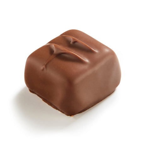 Milk chocolate covered marzipan with orange pieces from Margriet, by Jag Couture London New York, shown in a 16.5g package.