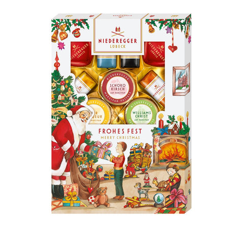 Marzipanerie specialties in festive Christmas sleeve by Jag Couture London New York, featuring colorful marzipan treats.