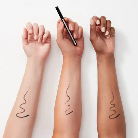 Maybelline Hyper Easy Liquid Eyeliner in Knockout Black, sleek black liquid eyeliner applied on the eye with precise tip.