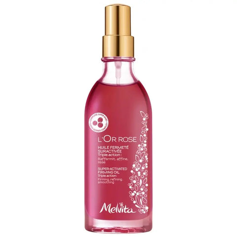 Bottle of Melvita L'Or Rose Super Active Firming Oil Bio in 100ml clear glass with rose gold cap, displayed on a neutral background