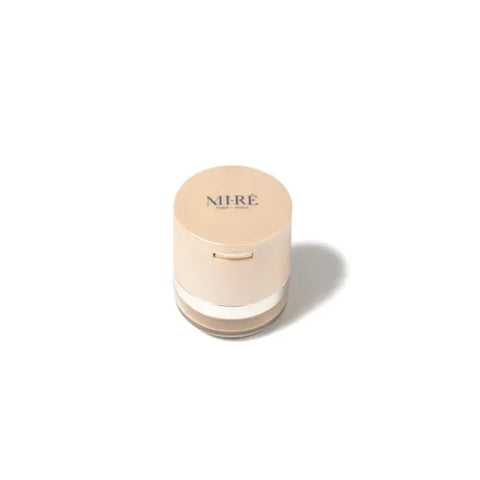 Mi-Rê Dual Sun-Lit Bronzer and Highlighter in Dore by Jag Couture London New York, showcasing the compact with shimmering gold finish.