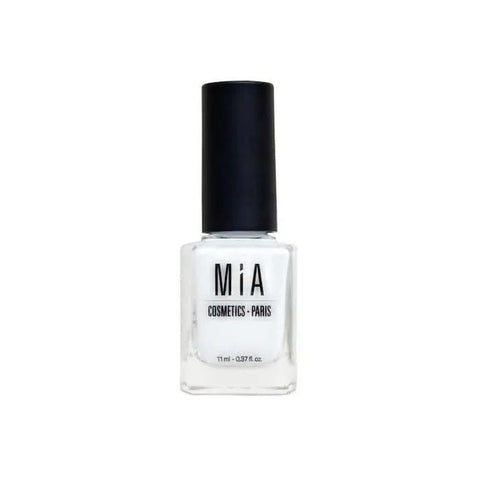 Jag Couture London - New York Mía Cosmetics Frost White nail polish bottle with white cap and clear glass, close-up shot.