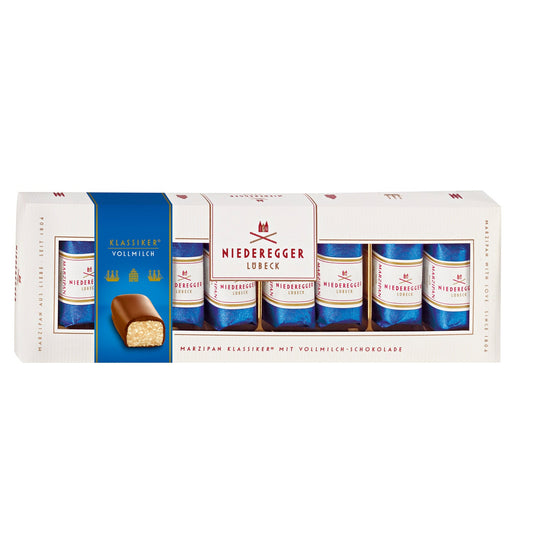Milk chocolate covered mini marzipan loaves in a gift box by Jag Couture London New York, showcasing glossy chocolate coating and marzipan inside.
