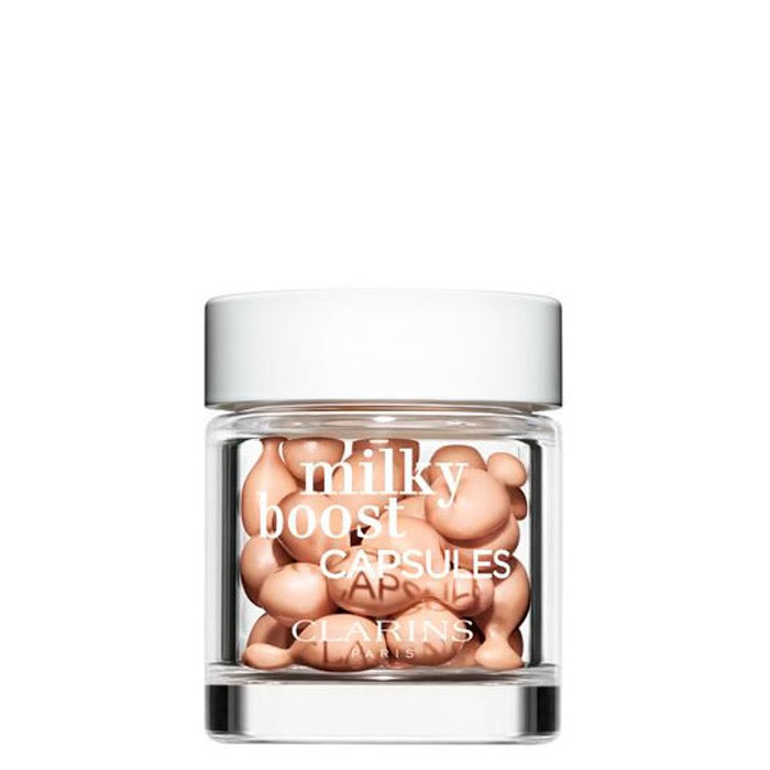 Jag Couture London-New York Milky Boost Fond De Teint 3 capsules in a sleek container, designed for radiant skin.