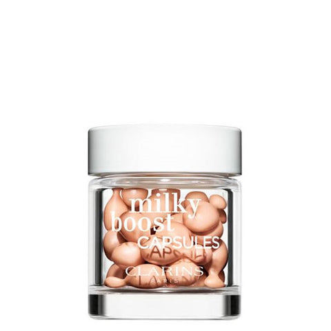 Jag Couture London-New York Milky Boost Fond De Teint 3 capsules in a sleek container, designed for radiant skin.