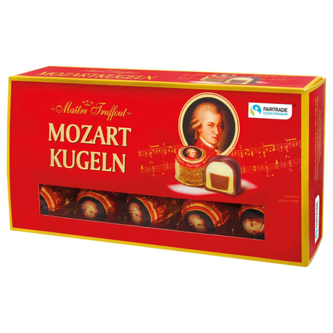 Jag Couture London Mozart Kugeln carton with milk and dark chocolate, pistachio marzipan, hazelnut praline, and marzipan bonbons.