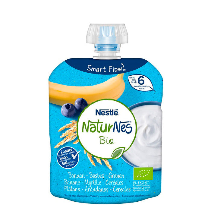 Naturnes Bio banana, blueberries, and cereals in a 90g package by Jag Couture London - New York, showing fresh fruits and cereal grains.