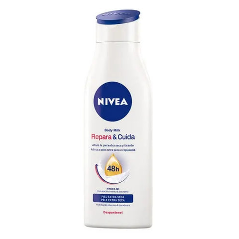Nivea Repair & Care Body Milk 400ml bottle with smooth, white lotion, branded by Jag Couture London - New York.