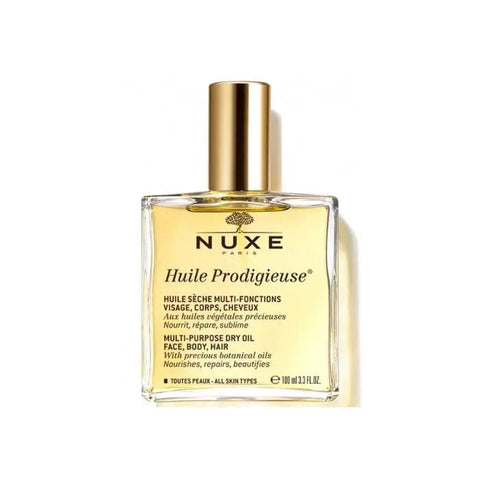 Nuxe Huile Prodigieuse multi-purpose dry oil bottle, 100ml, with golden cap and textured label, on a neutral background.