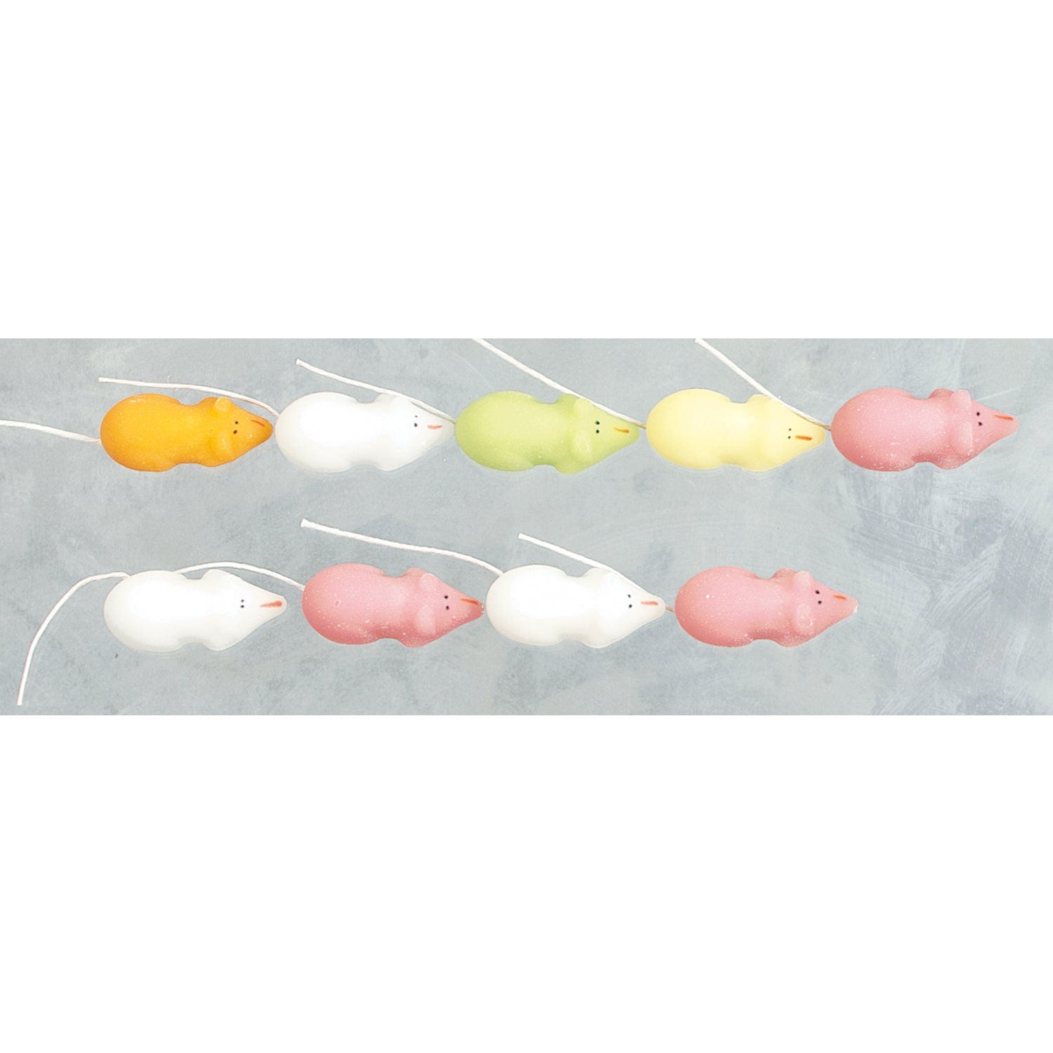Pink and white sugar mice candies in a bulk box from Jag Couture London New York, colorful and sweet confections for baking or decoration.