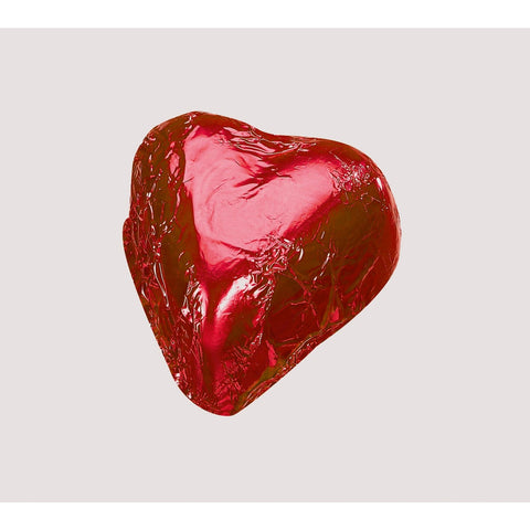 Red foiled heart-shaped milk chocolate with praline by Jag Couture London New York, 11g, showcasing shiny red foil wrapping.