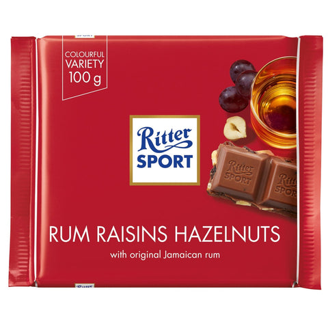 Jag Couture London - New York Ritter Sport milk chocolate bar with rum, raisins, and hazelnuts, showing the chocolate pieces with nuts and fruit.