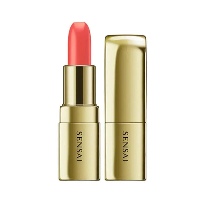 Jag Couture London New York Sensai The Lipstick 04 Hinageshi Orange, vibrant orange lipstick with sleek packaging.
