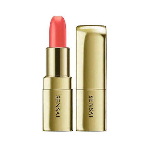Sensai The Lipstick 04 Hinageshi Orange by Jag Couture London features vibrant orange lipstick in elegant packaging.
