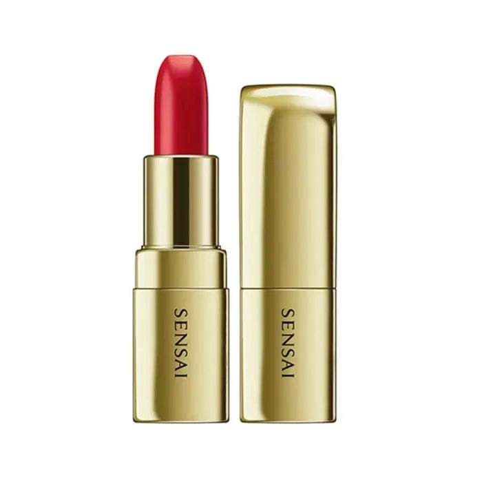 Sensai The Lipstick 05 Nimawari Orange by Jag Couture London - New York, close-up of vibrant orange lipstick in sleek packaging.