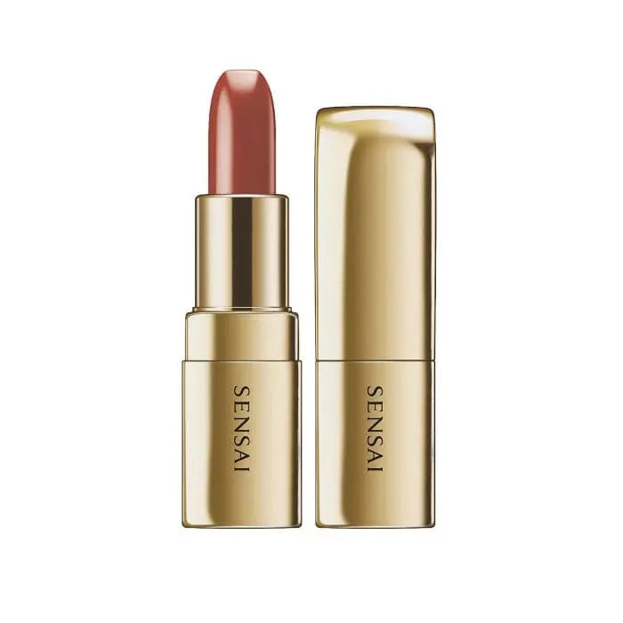 Sensai The Lipstick 15 Kuchinashi Nude by Jag Couture London - New York, showcasing the nude lipstick with a sleek tube and color swatch.
