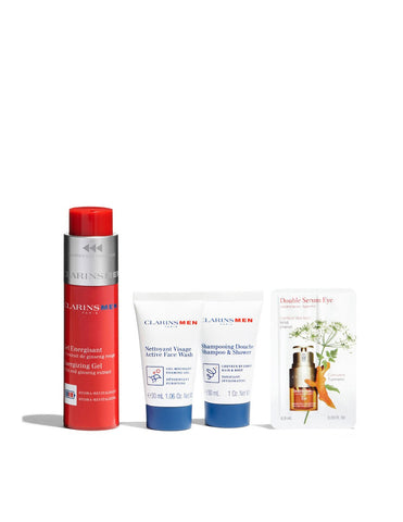 Jag Couture London New York Clarins Men energizing gel 50ml, shampoo 30ml, and facial cleanser 30ml set on white background.