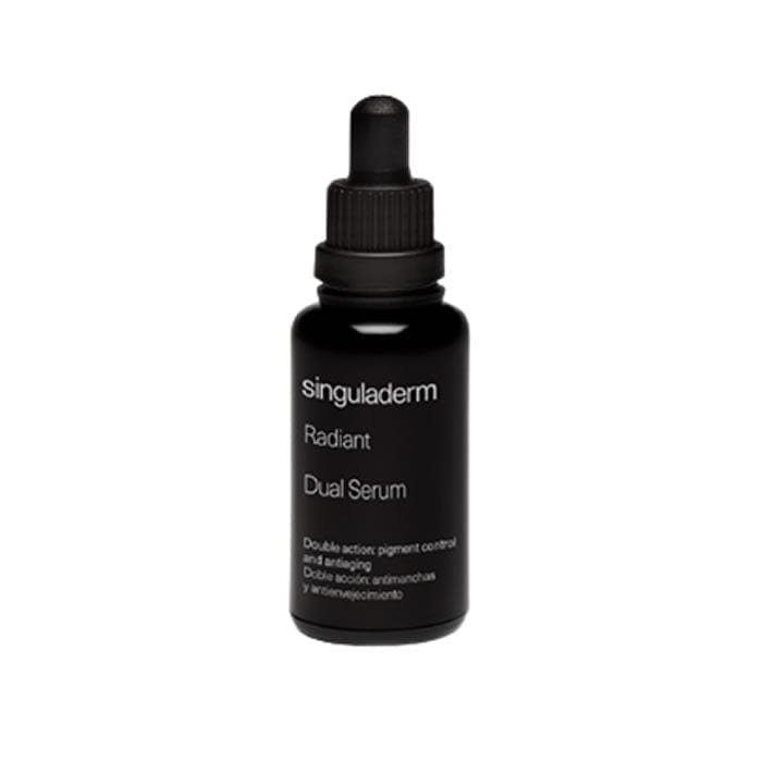 Jag Couture London New York Singuladerm Radiant Dual Serum 30ml bottle, sleek packaging with a silver cap and clear glass container.