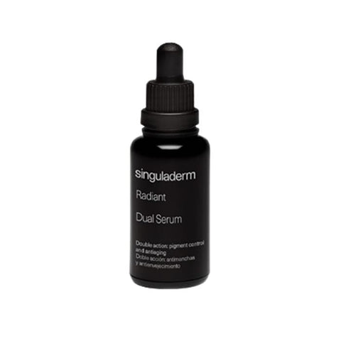 Jag Couture London New York Singuladerm Radiant Dual Serum 30ml bottle, sleek packaging with a silver cap and clear glass container.