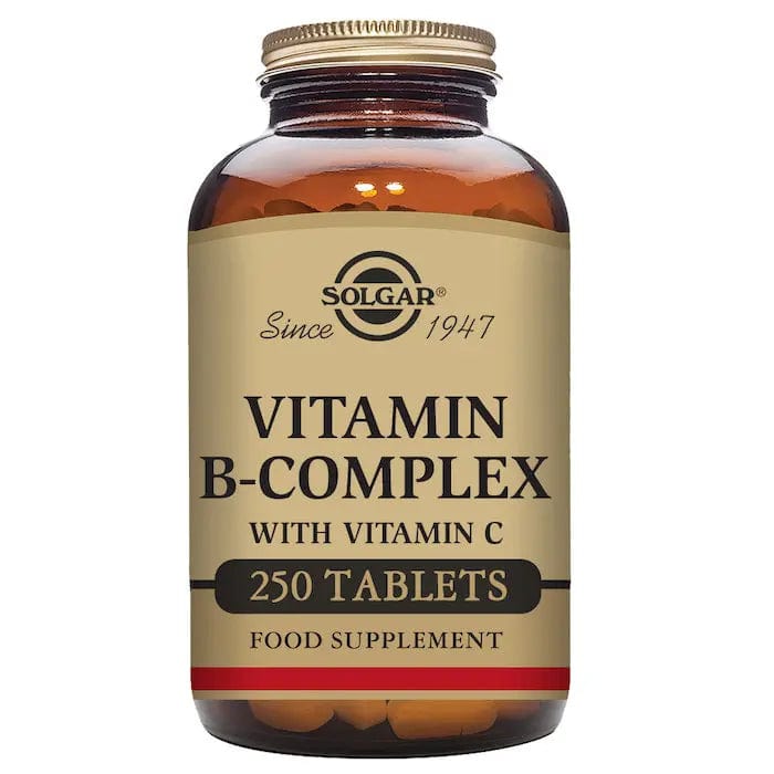 Solgar B-Complex Vitamin C 250 tablets supplement in a white bottle with a green label, displayed on a neutral background.
