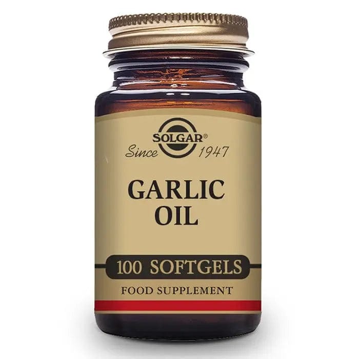 Solgar Garlic Oil softgels, dietary supplement, in clear bottle with 100 softgels, on a white background.
