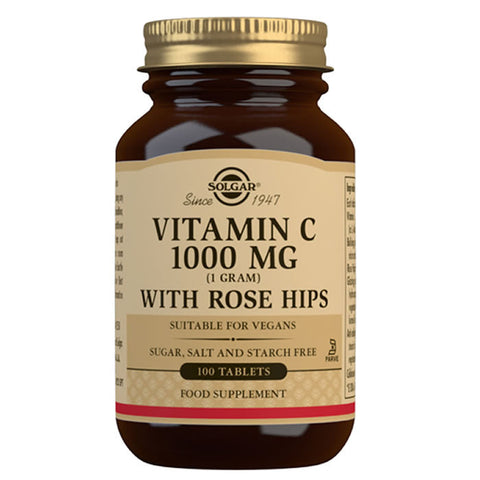 Solgar Vitamin C 1g supplement with 100 tablets and rose hip, in a bottle, displayed on a white background.