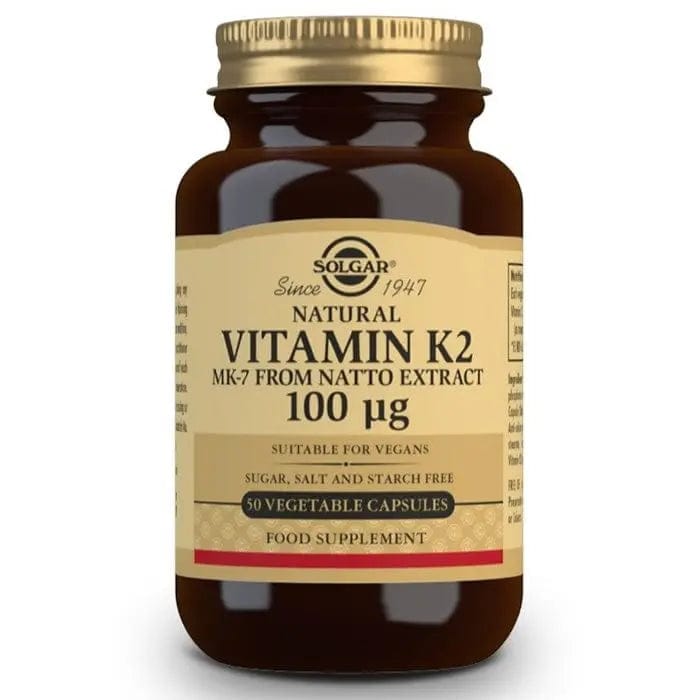 Solgar Vitamin K2 100 µg supplement in 50 capsules, featuring the product bottle with label and capsules inside.