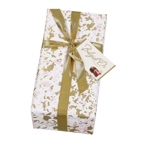 Splatter design gift-wrapped ballotin of assorted Belgian chocolates by Jag Couture London New York, beautifully presented.