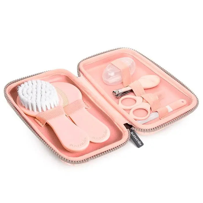 Set of seven pink Suavinex Hygge baby manicure tools, including clippers, scissors, and files, in a compact pink case.