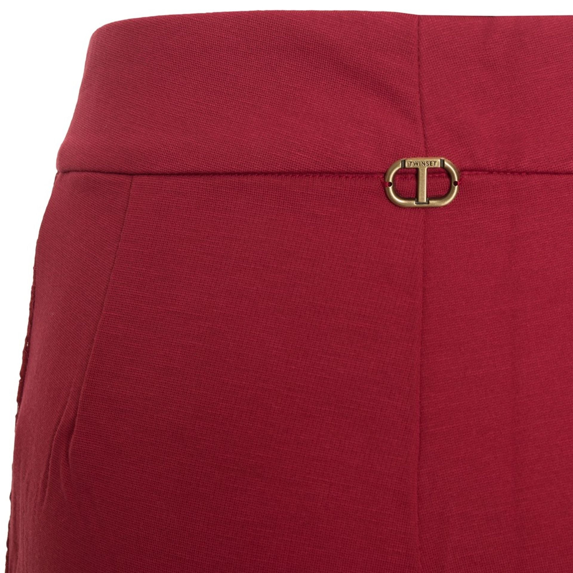 Twinset by Jag Couture London-New York, featuring a stylish knit top in a close-up image showcasing fabric details and design.